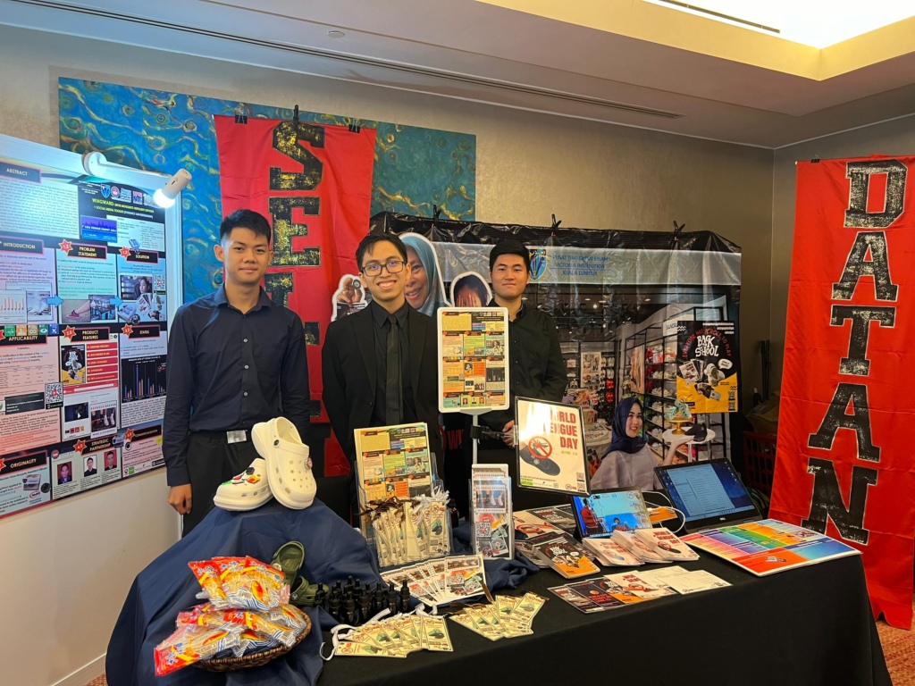 The winning team at their booth during the Grand Finals at Kuala Lumpur, Malaysia.
